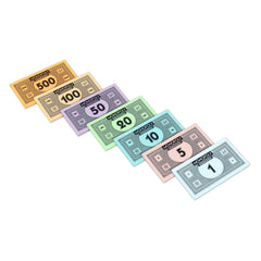 Monopoly game money in various denominations arranged in a fan shape.